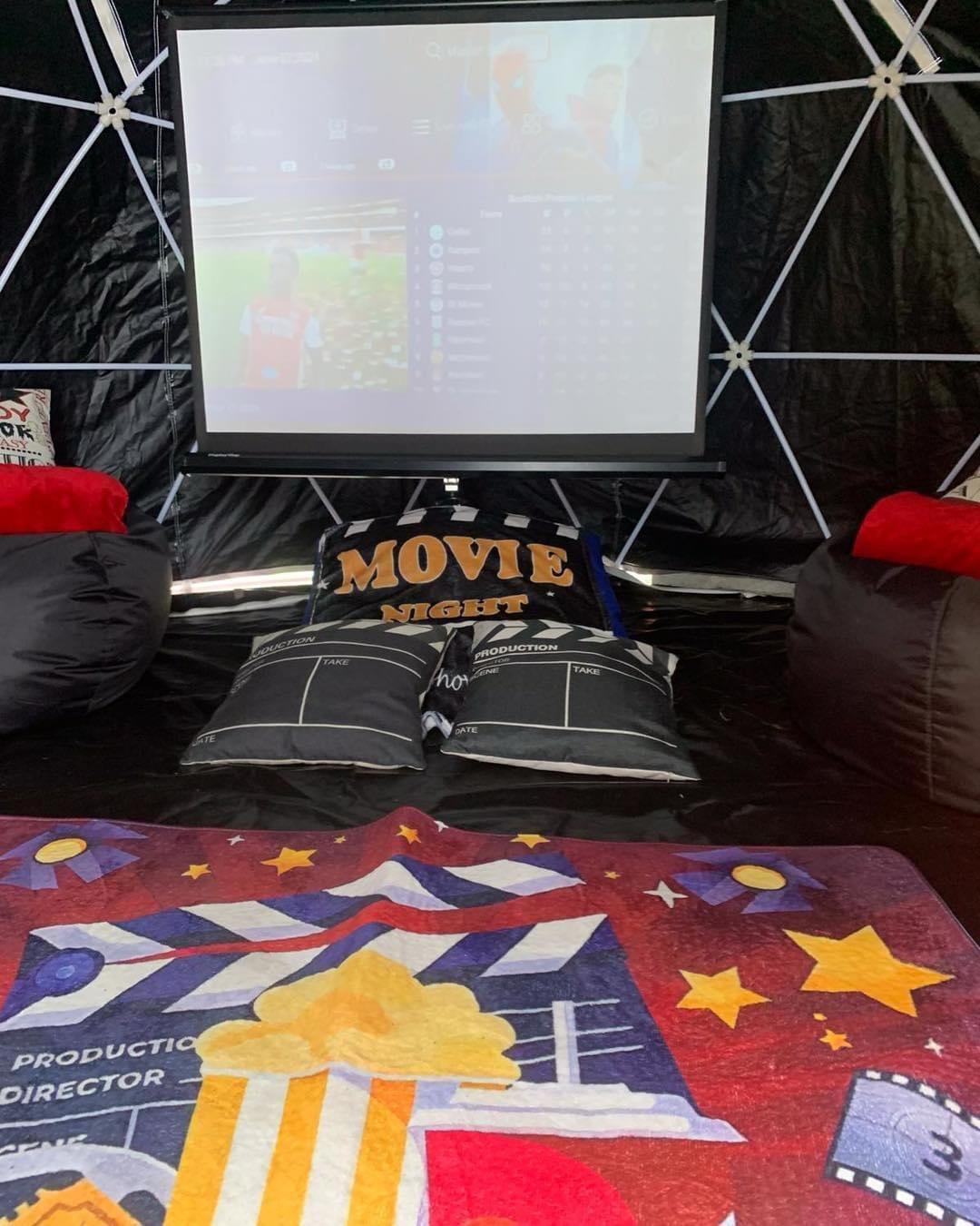 Movie night set-up - back garden igloo with blackout cover for unique birthday parties and celebrations