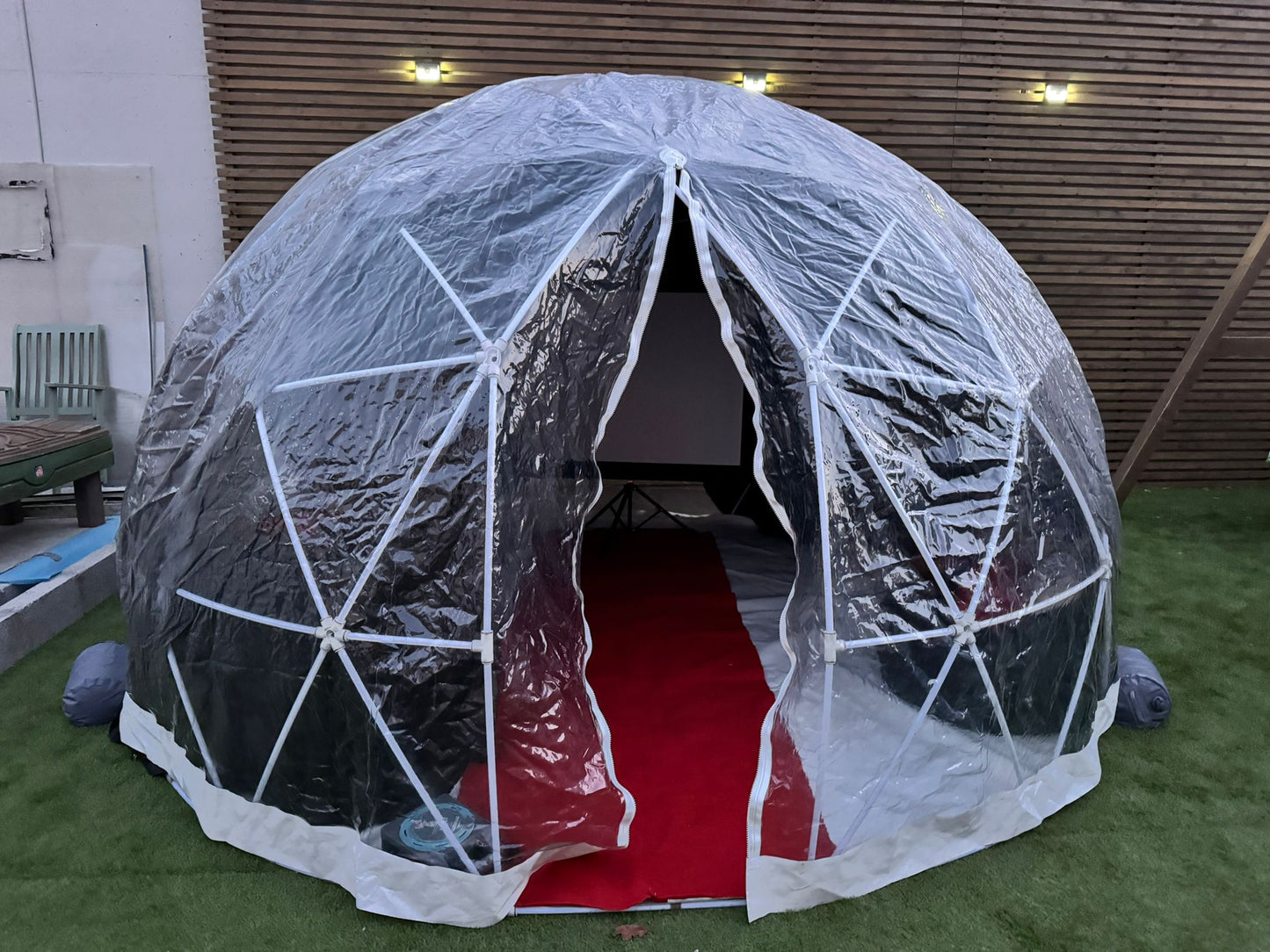 Party igloo set-up in a back garden, perfect for movie nights and gaming nights
