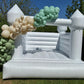White Bouncy Castle with Custom Green & Gold Balloon Garland in a Back Garden, Cork 
